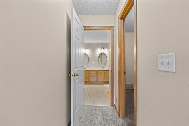 20354 Kensfield Trl Unit 1403, Lakeville, MN 55044 - corridor with light colored carpet, a textured ceiling, and light tile patterned floors