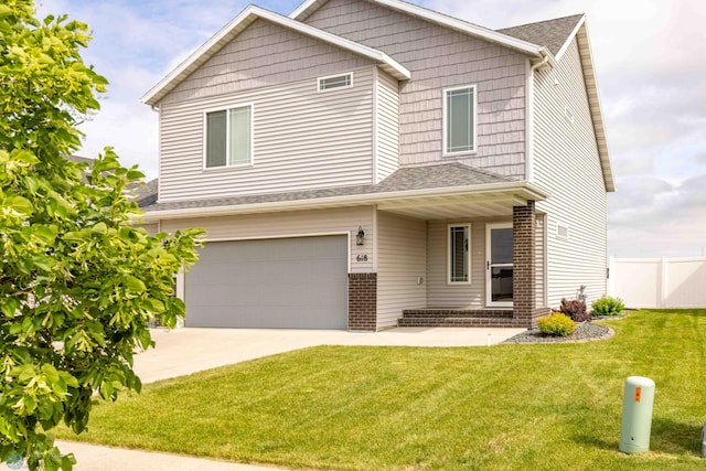 618 23rd Ave W, West Fargo, ND 58078 - view of front of home with a garage, concrete driveway, and roof with shingles