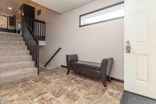 618 23rd Ave W, West Fargo, ND 58078 - entryway with stone finish flooring and stairway