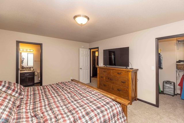618 23rd Ave W, West Fargo, ND 58078 - bedroom with light carpet, a closet, ensuite bath, and a spacious closet