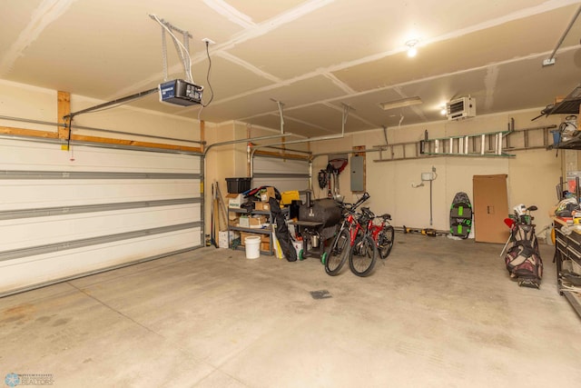 618 23rd Ave W, West Fargo, ND 58078 - garage featuring a garage door opener and electric panel