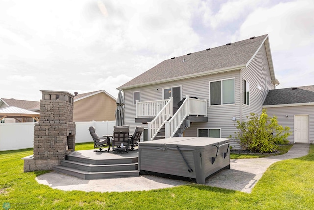 618 23rd Ave W, West Fargo, ND 58078 - rear view of property with a hot tub, a deck, a shingled roof, and a patio area