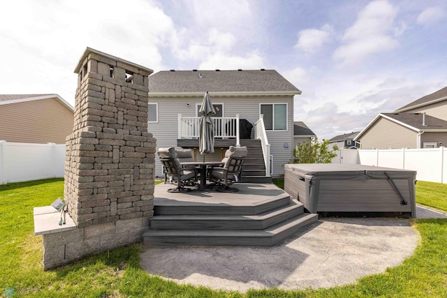 618 23rd Ave W, West Fargo, ND 58078 - rear view of property with a deck, a hot tub, a fenced backyard, and stairs