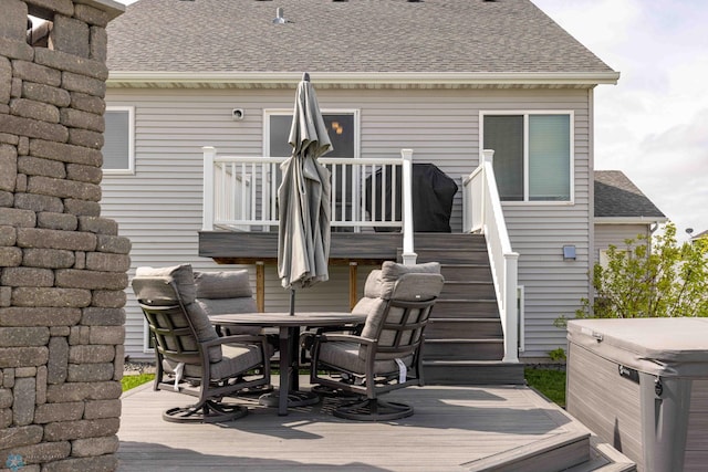 618 23rd Ave W, West Fargo, ND 58078 - wooden terrace featuring a hot tub, outdoor dining area, and stairway