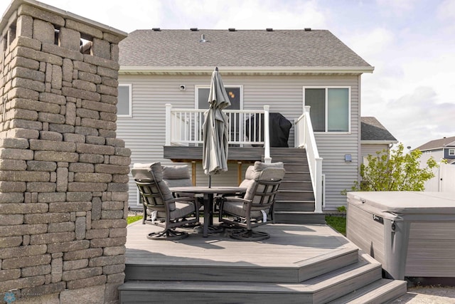 618 23rd Ave W, West Fargo, ND 58078 - wooden deck featuring a hot tub, outdoor dining area, and stairway
