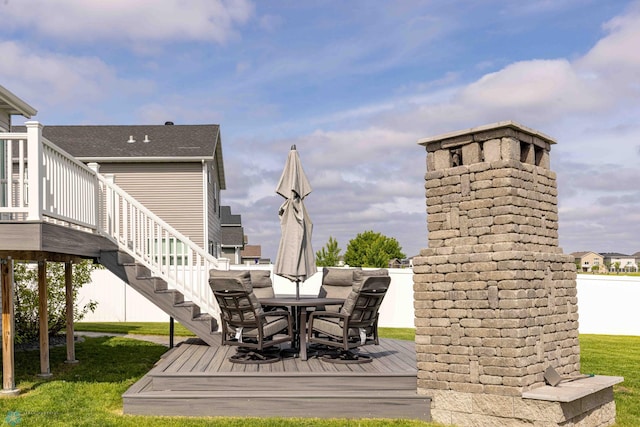 618 23rd Ave W, West Fargo, ND 58078 - wooden deck with a lawn, stairs, and outdoor dining area