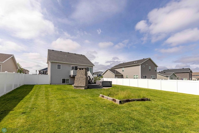 618 23rd Ave W, West Fargo, ND 58078 - back of property with a fenced backyard, a residential view, stairway, and a deck