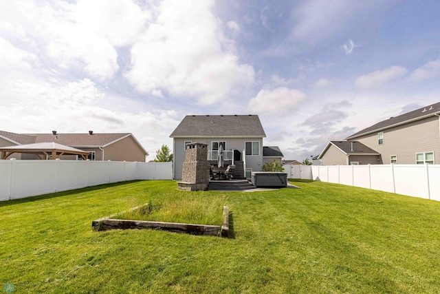 618 23rd Ave W, West Fargo, ND 58078 - back of house with a fenced backyard and a wooden deck