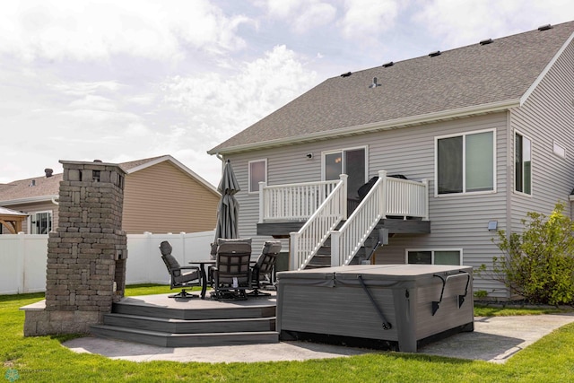 618 23rd Ave W, West Fargo, ND 58078 - back of house with a hot tub, a deck, and a shingled roof
