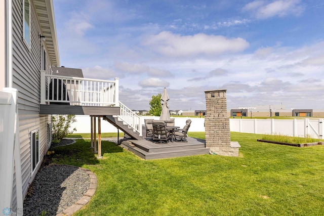 618 23rd Ave W, West Fargo, ND 58078 - view of yard featuring a wooden deck, stairway, and outdoor dining space