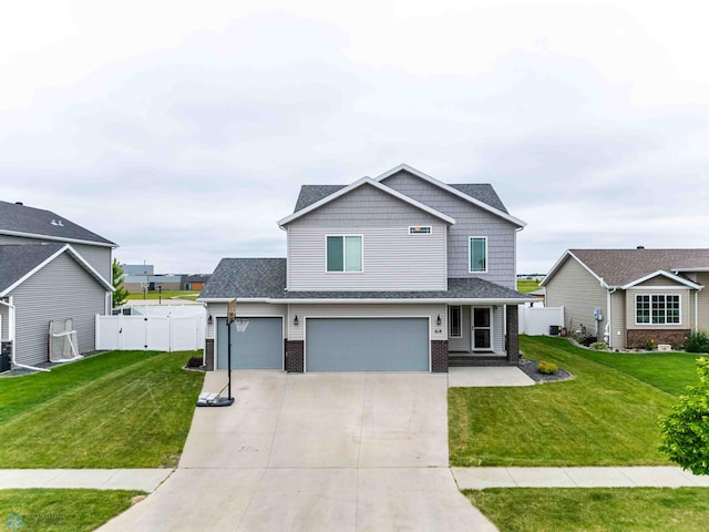 618 23rd Ave W, West Fargo, ND 58078 - view of front of house featuring driveway, a gate, a garage, and brick siding
