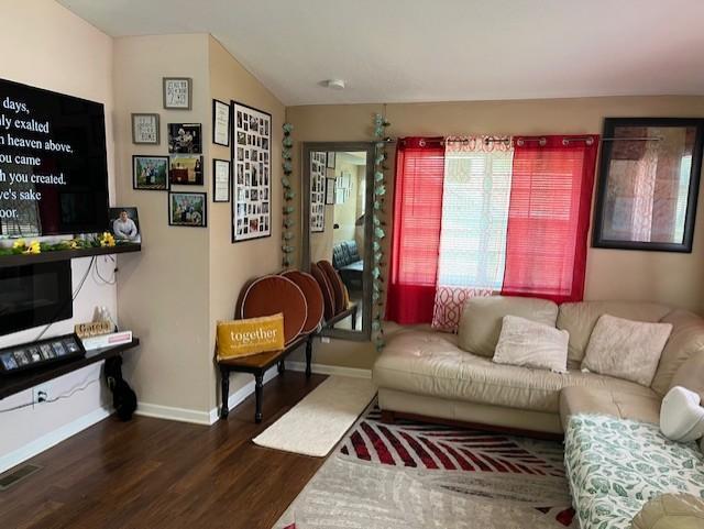 905 Main St, Marshall, MN 56258 - living room featuring dark wood-type flooring and baseboards