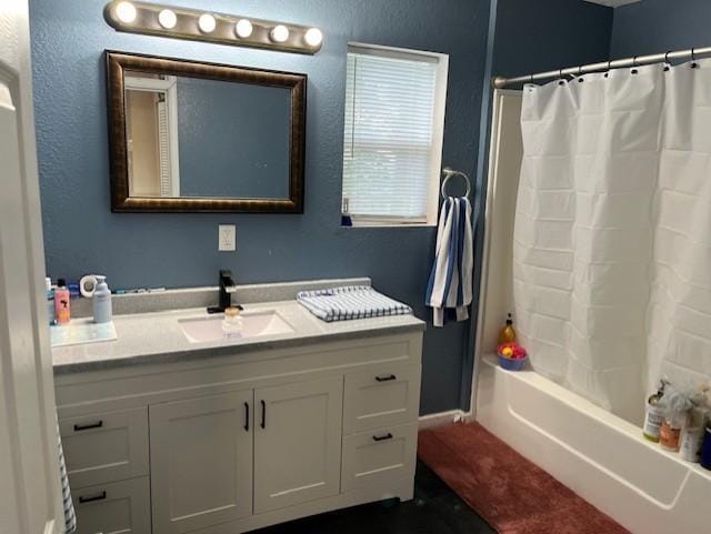 905 Main St, Marshall, MN 56258 - bathroom featuring vanity and shower / bathtub combination with curtain