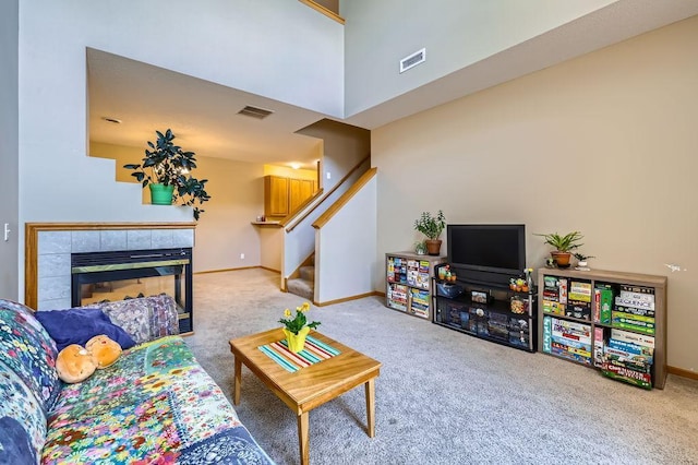 11182 204th St W Unit 908, Lakeville, MN 55044 - living room with carpet floors, stairs, and a fireplace