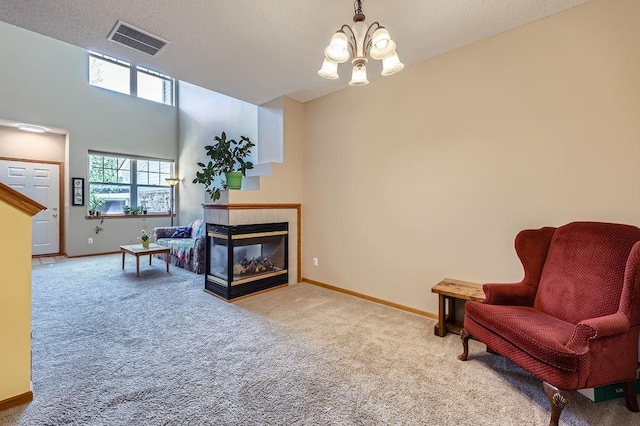 11182 204th St W Unit 908, Lakeville, MN 55044 - sitting room with carpet, a chandelier, and a tiled fireplace