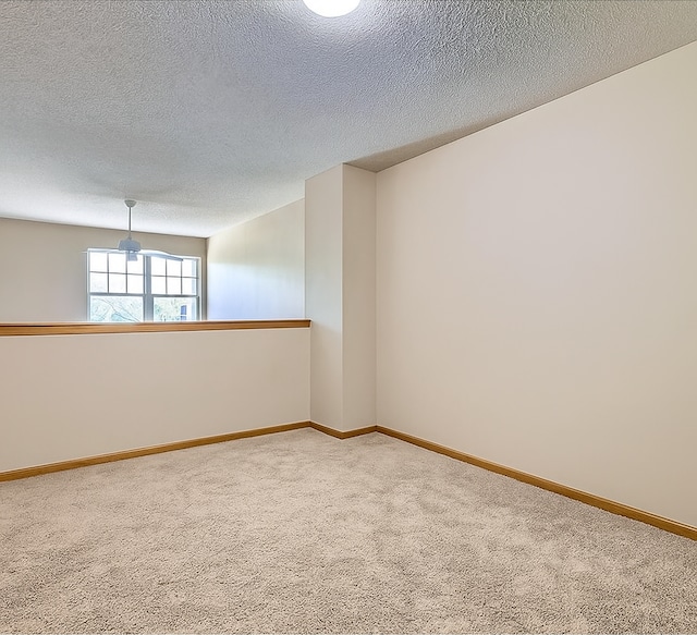 11182 204th St W Unit 908, Lakeville, MN 55044 - spare room featuring carpet and a textured ceiling