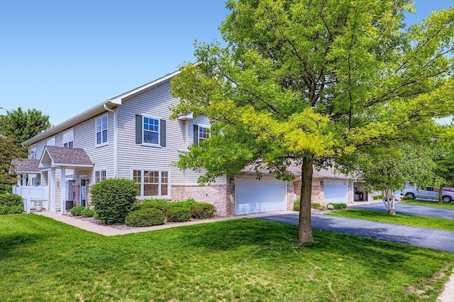 11182 204th St W Unit 908, Lakeville, MN 55044 - view of front of property with a garage, driveway, and a front lawn