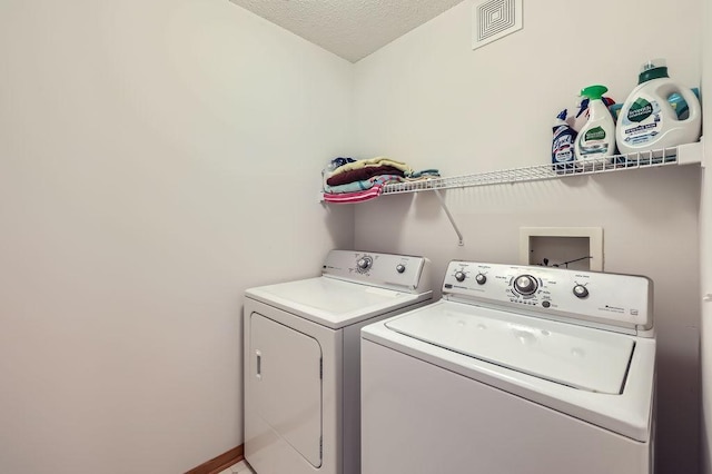 11182 204th St W Unit 908, Lakeville, MN 55044 - laundry room with washing machine and dryer and a textured ceiling