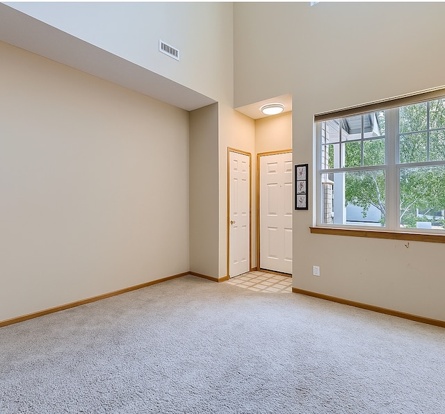 11182 204th St W Unit 908, Lakeville, MN 55044 - foyer entrance with a high ceiling, light carpet, and plenty of natural light
