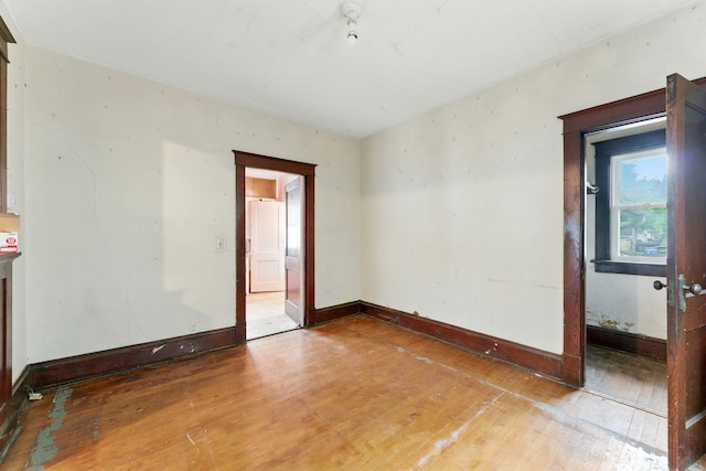 976 Forest St, Saint Paul, MN 55106 - empty room featuring hardwood / wood-style floors and baseboards
