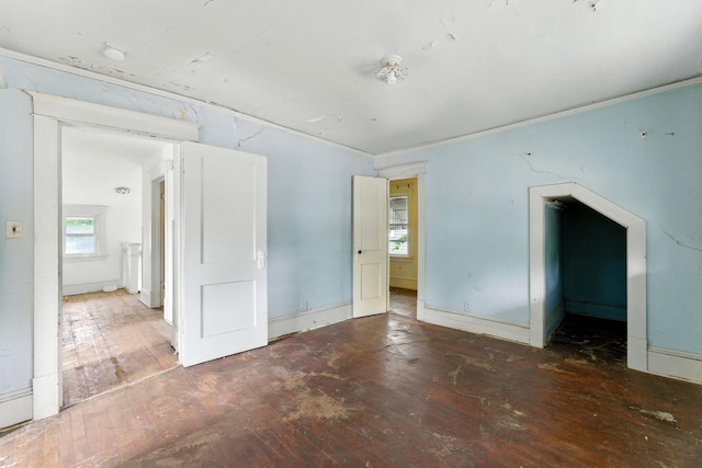 976 Forest St, Saint Paul, MN 55106 - unfurnished bedroom with wood-type flooring and multiple windows