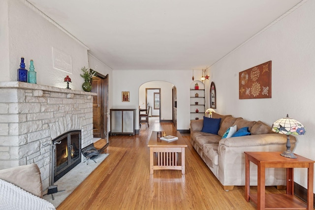 300 Diamond Lake Rd, Minneapolis, MN 55419 - living room with wood finished floors, arched walkways, and a stone fireplace