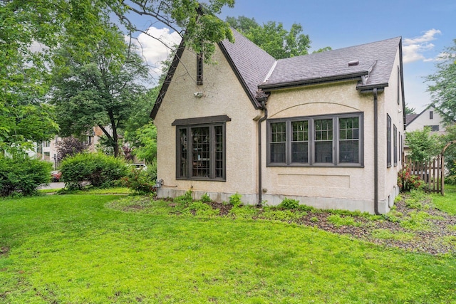 300 Diamond Lake Rd, Minneapolis, MN 55419 - view of property exterior featuring a lawn, stucco siding, and a shingled roof