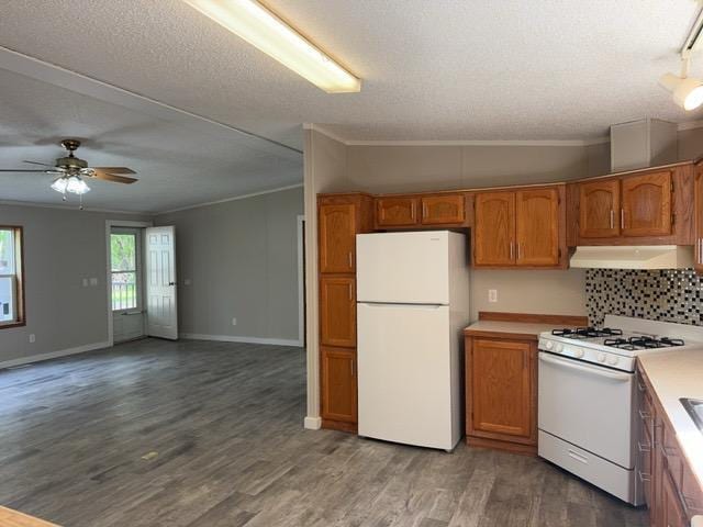 19531 Explorer Trl, Todd Twp, MN 56470 - kitchen featuring white appliances, exhaust hood, crown molding, brown cabinetry, and wood finished floors