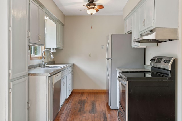 723 2nd Ave S, Buffalo, MN 55313 - kitchen with appliances with stainless steel finishes, under cabinet range hood, ceiling fan, hardwood / wood-style floors, and light countertops