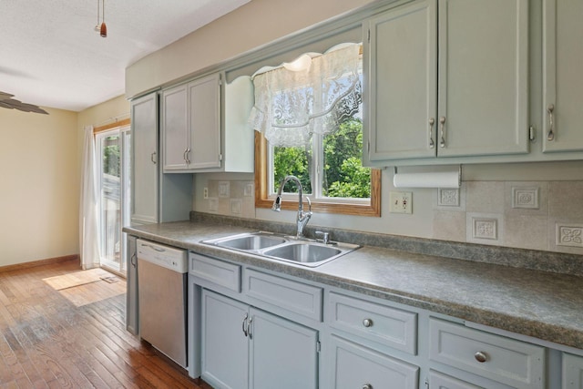 723 2nd Ave S, Buffalo, MN 55313 - kitchen with white dishwasher, dark wood-style floors, dark countertops, and a textured ceiling