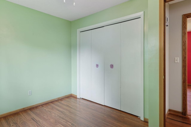 723 2nd Ave S, Buffalo, MN 55313 - unfurnished bedroom featuring wood finished floors and a closet