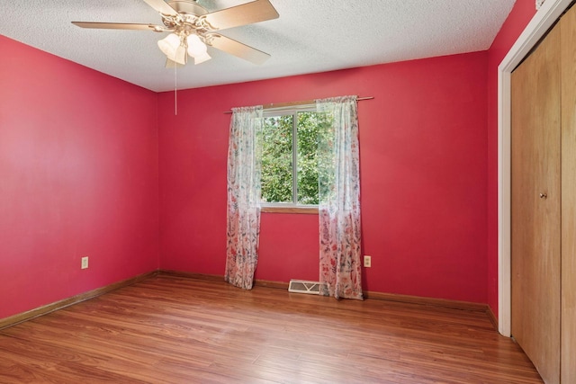 723 2nd Ave S, Buffalo, MN 55313 - empty room featuring wood finished floors, a textured ceiling, and ceiling fan