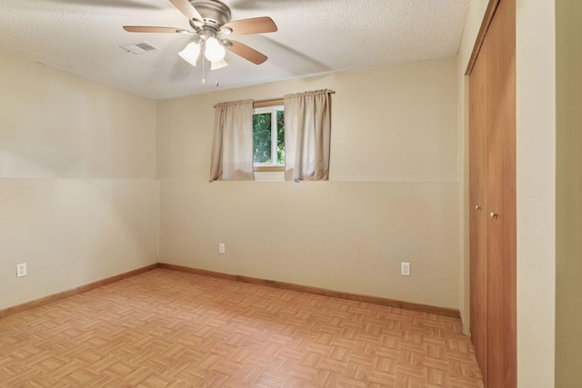 723 2nd Ave S, Buffalo, MN 55313 - empty room featuring ceiling fan and a textured ceiling