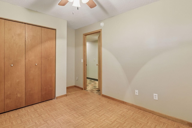 723 2nd Ave S, Buffalo, MN 55313 - unfurnished bedroom with a closet, a ceiling fan, and a textured ceiling