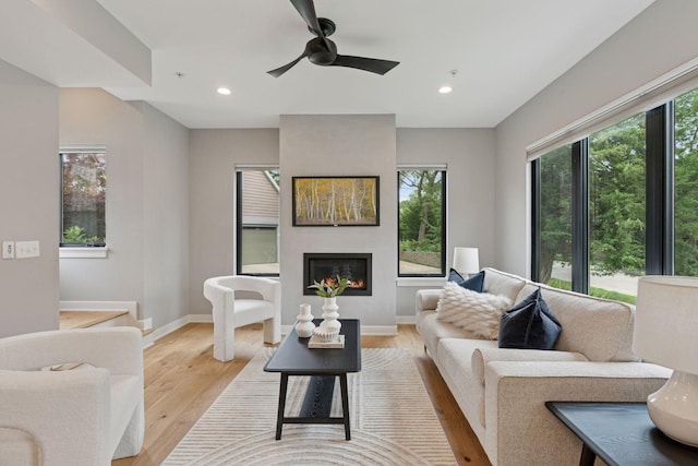 2820 Saint Louis Ave, Minneapolis, MN 55416 - living room featuring a large fireplace, recessed lighting, light wood finished floors, and ceiling fan