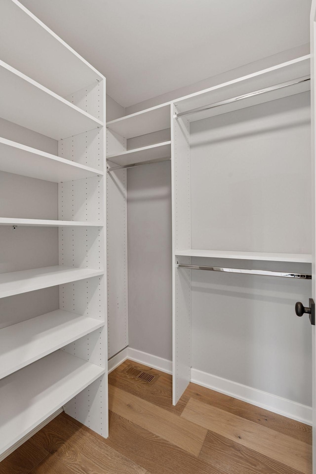 2820 Saint Louis Ave, Minneapolis, MN 55416 - spacious closet featuring wood finished floors