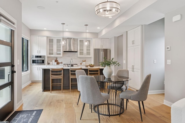 2820 Saint Louis Ave, Minneapolis, MN 55416 - dining area featuring light wood-type flooring and recessed lighting