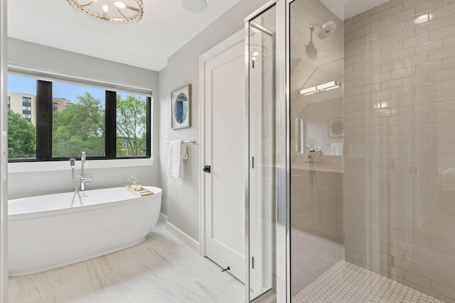 2820 Saint Louis Ave, Minneapolis, MN 55416 - bathroom with a shower stall, a soaking tub, and a chandelier