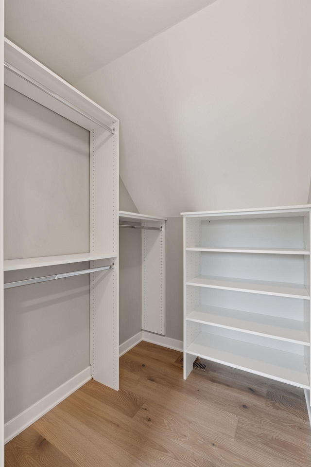 2820 Saint Louis Ave, Minneapolis, MN 55416 - spacious closet featuring wood finished floors and lofted ceiling