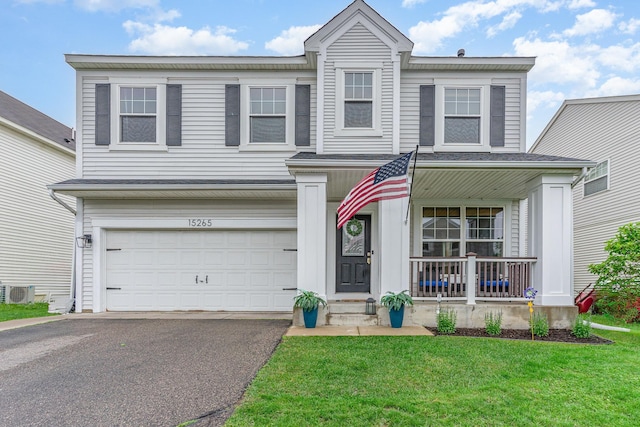 15265 Dupont Path, Apple Valley, MN 55124 - traditional home featuring a porch, driveway, a garage, and a front lawn