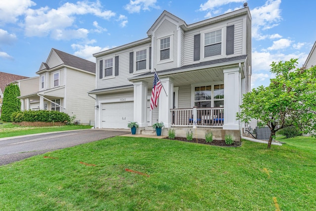 15265 Dupont Path, Apple Valley, MN 55124 - traditional-style house with covered porch, a garage, driveway, and a front lawn