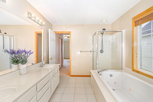 15265 Dupont Path, Apple Valley, MN 55124 - full bathroom with a stall shower, a tub with jets, double vanity, tile patterned floors, and a textured ceiling
