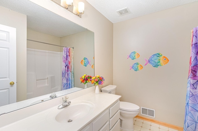 15265 Dupont Path, Apple Valley, MN 55124 - bathroom with vanity, curtained shower, a textured ceiling, and tile patterned floors