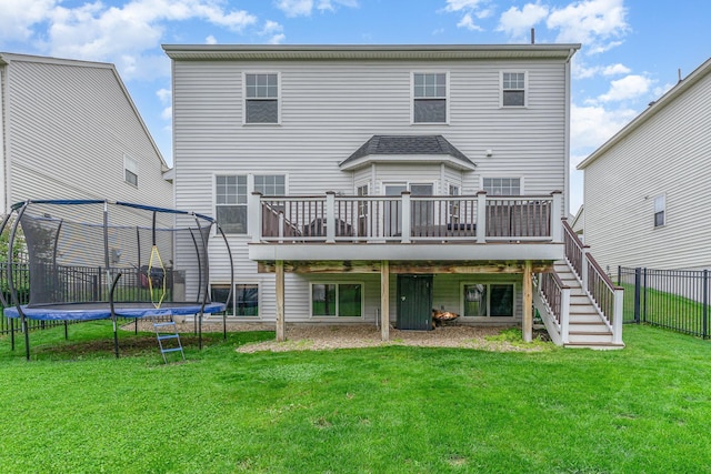 15265 Dupont Path, Apple Valley, MN 55124 - rear view of property featuring a trampoline, a wooden deck, and stairs