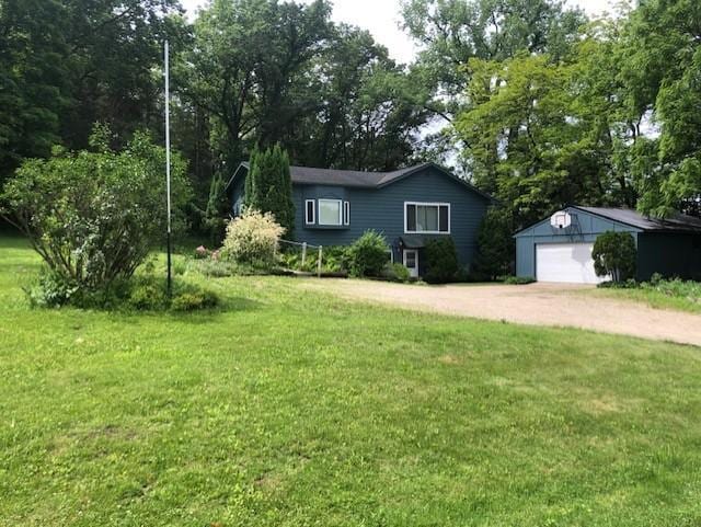 300 Whittier St W, Lanesboro, MN 55949 - single story home featuring an outbuilding, dirt driveway, a detached garage, and a front yard