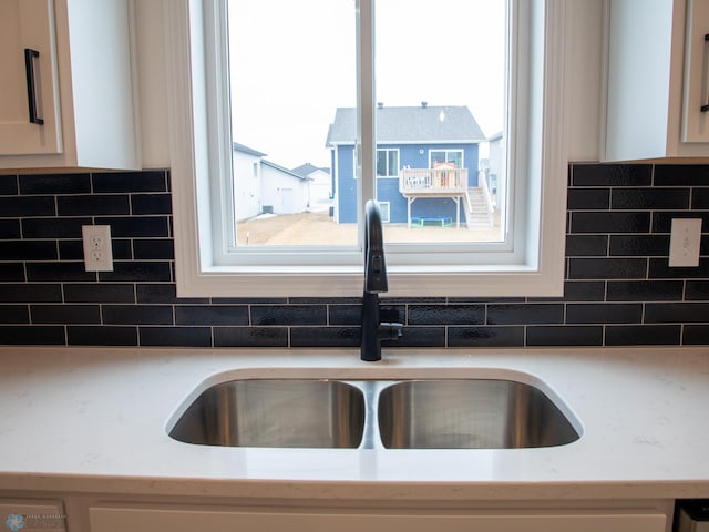 7901 Lost River Rd, Horace, ND 58047 - kitchen view of white cabinets and tasteful backsplash