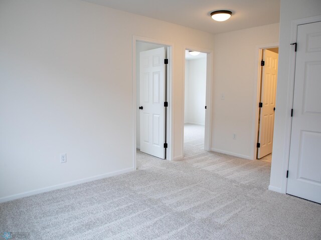 7901 Lost River Rd, Horace, ND 58047 - spare room with light colored carpet and baseboards
