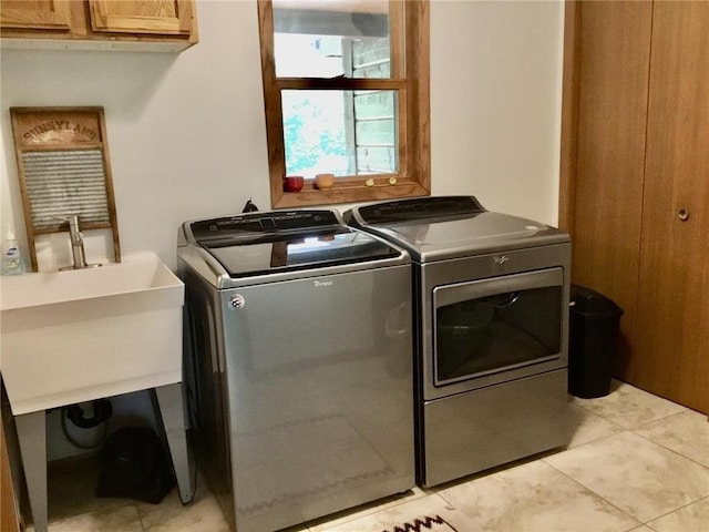 17136 Hidden Lake Rd, Fifty Lakes, MN 56448 - washroom with cabinet space, washing machine and clothes dryer, and light tile patterned floors
