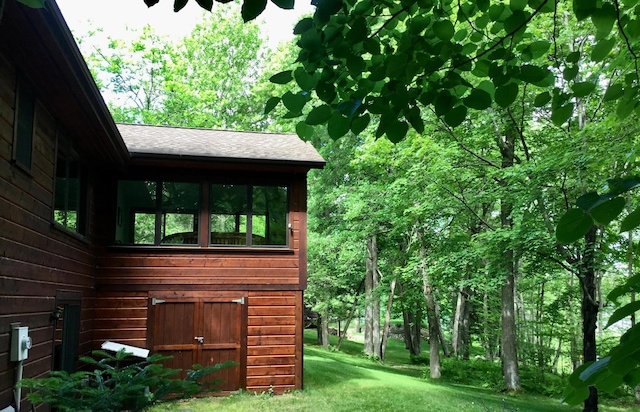 17136 Hidden Lake Rd, Fifty Lakes, MN 56448 - view of home's exterior with a shingled roof and a yard