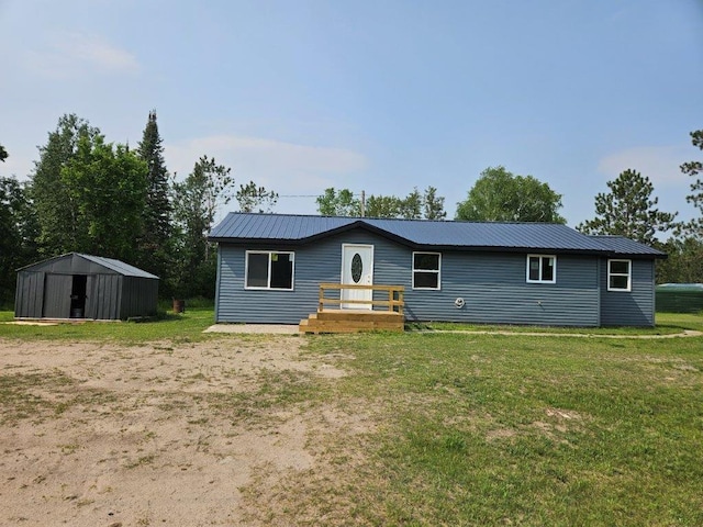 10091 Trengove Rd NW, Bemidji, MN 56601 - view of front of home featuring a front lawn and a metal roof